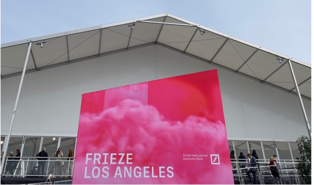 Frieze Los Angeles hot pink banner displayed in front of the Santa Monica Airport, February 2023. 