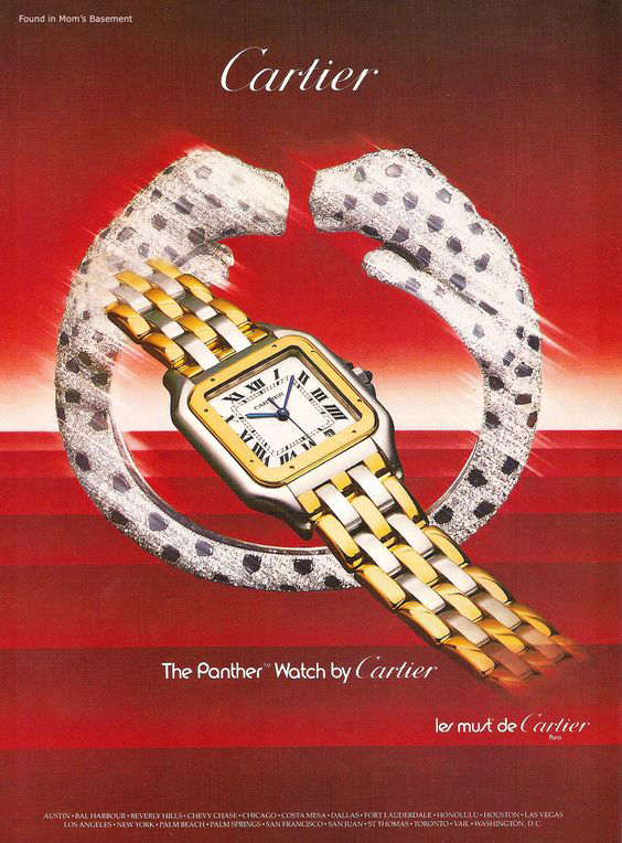 Vintage magazine advertisement for Cartier jewelry, featuring a gold woman's watch and panther themed diamond cuff bracelet. Background is red.