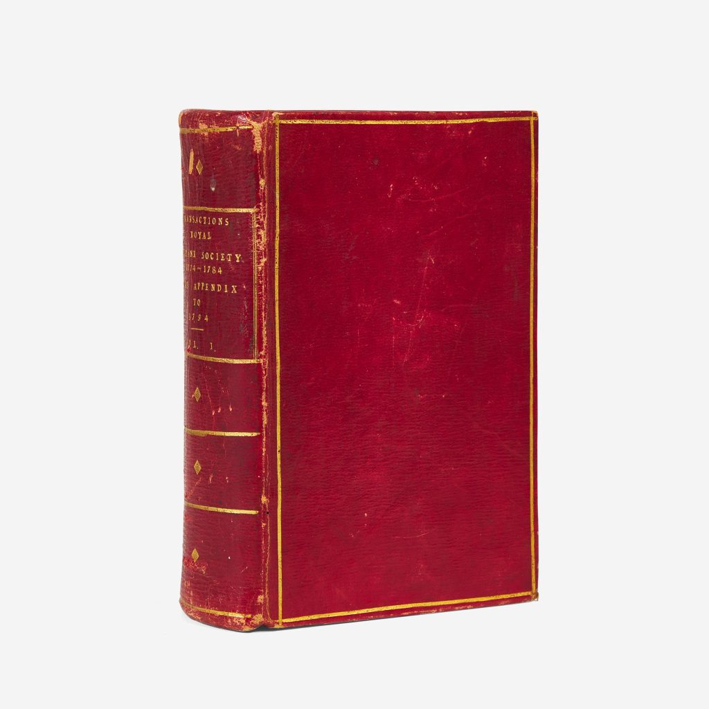The picture is of an antique red and gold book.