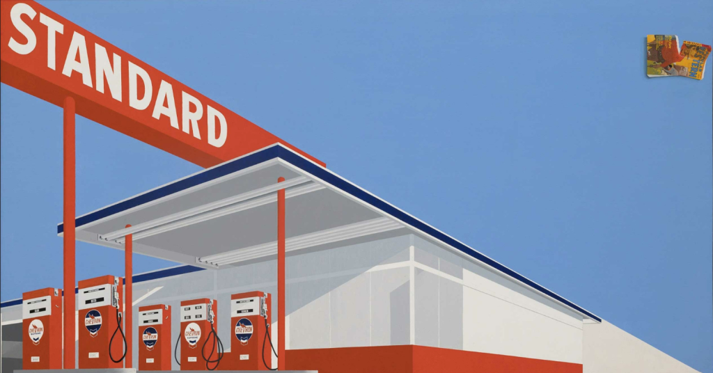 Painting by Ed Ruscha depicting an angled view of a red and white Standard gas station on a blue sky background. There is a ripped magazine in the top right corner of the painting.
