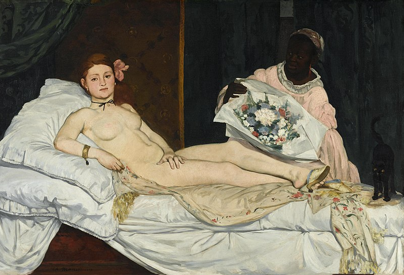 A portrait painting by Edouard Manet depicting a white woman in nude laying on a day bed leaning on pillows and sitting over a tan floral cloth. She has a flower in her hair and a black string around her neck. There is a black woman to the right of the woman in the painting in a pink dress presenting a bouquet of red, white, black, and pink flowers to the reclined woman.  