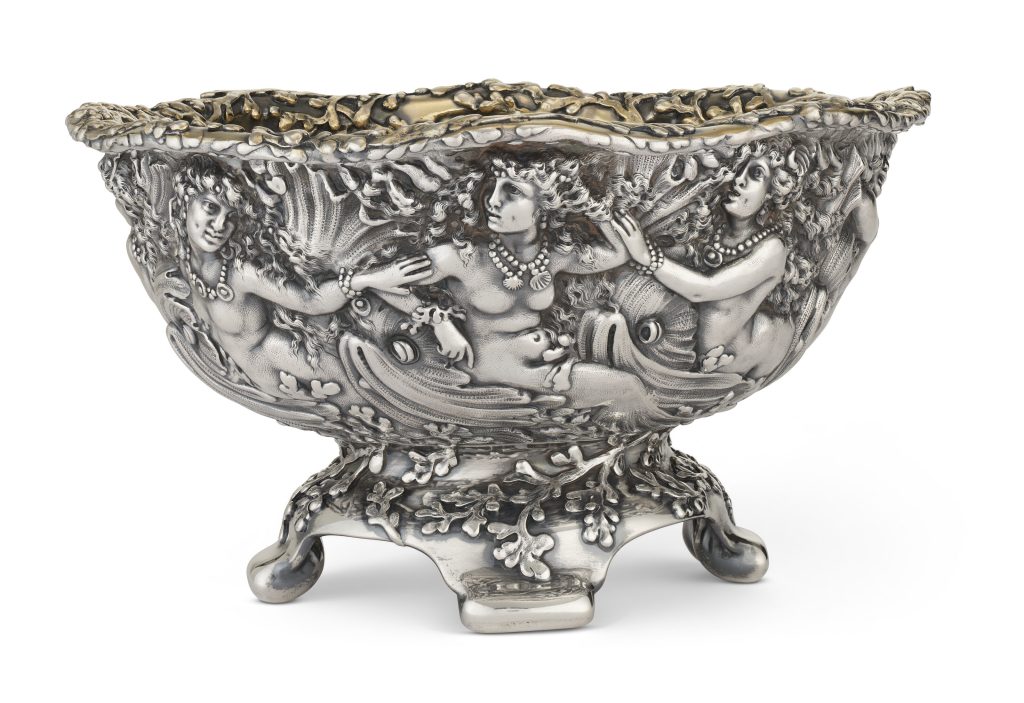 CHARLES OSBORNE
An American Silver Centerpiece Bowl Diameter: 12 1/4 in.  
Silver

ESTIMATE:
USD 10,000 – 15,000
ACHIEVED:
USD 35,280 (Premium)

Silver bowl with detailed etching of three naked women in jewelry, among branches.