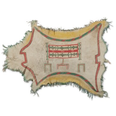 Arapho Child’s Robe with Incised and Painted Box-and-Border Design, 19th Century
41 x 61 in.

ESTIMATE:
USD 25,000 – 35,000
ACHIEVED:
USD 317,500 (Premium)

Tan cloth with a orange and blue stitching outlines, there is a tribal print stitched into the middle.