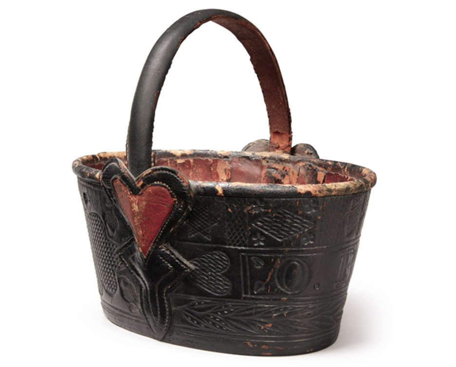 Sotheby's                                                                                                              January 25, 2020 - Triumphant Grace: Important Americana from the Collection of Barbara and Arun Singh
Sale N10303
Lot 1072
Rare Stamp and Punch-Decorated Black and Red Leather Key Basket
Circa 1800